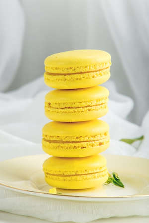 Yellow banana macarons. French delicate dessert for Breakfast in the morning lightの写真素材