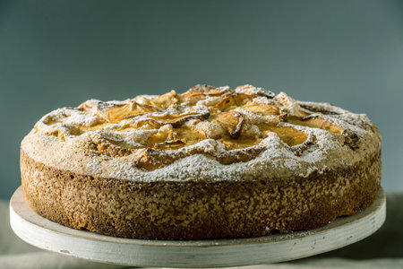 Apple pie and desserts on the table. Tea party in a rustic style. Concept of sweet autumn still lifeの写真素材