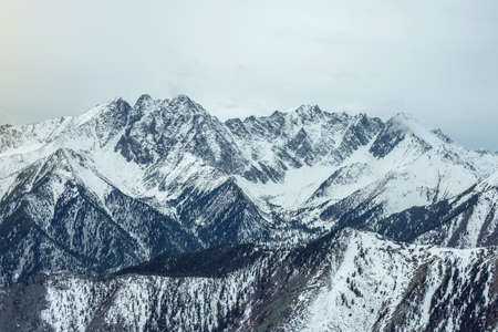 Beautiful views of the snowy peaks of the Baikal mountains at sunrise. The concept of travel and Hiking tripsの写真素材