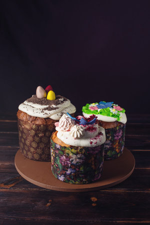 Festive table with cake and colorful eggs on wooden background. The concept of Orthodox Easter