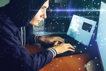 young hacker in the dark breaks the access to steal information and infect computers and systems....