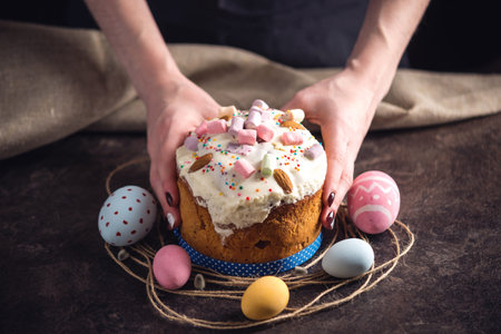 Card with traditional desserts and colorful eggs in rustic style on a dark background. Concept happy...