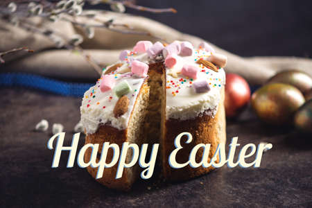 A card with traditional Easter cakes and colorful eggs and text on a dark background. Concept happy Easterの写真素材