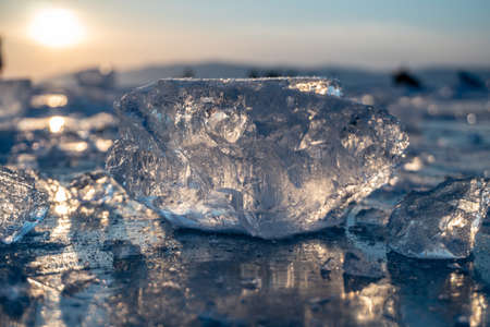 Pieces of clear blue ice of lake Baikal in the winter sunlight. Beauty of natureの写真素材