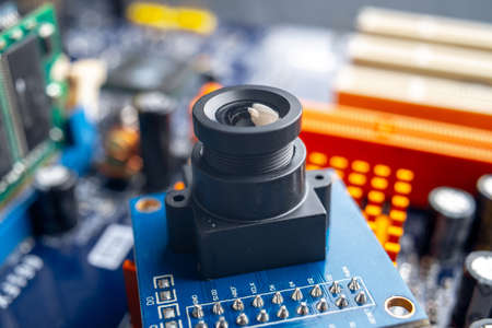 Camera with lens on electronic integrated circuit Board. The concept of high technology and roboticsの写真素材