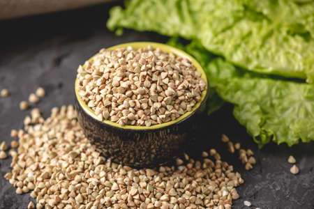Organic food cereals green buckwheat. Vegan nutritious and healthy product. The concept of products for health careの写真素材