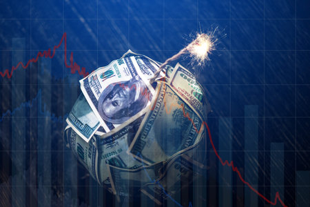 Bomb money like dynamite, hundred-dollar bill with a burning wick with drop charts on blue background. Waiting for the explosion of investment markets. The concept of the financial crisisの写真素材