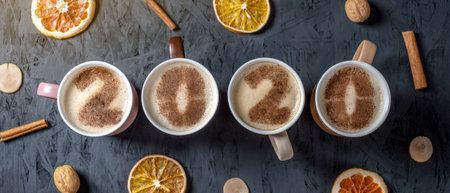 Card with numbers 2020 for New year and Christmas. Cup of coffee with figures on milk foam on black...