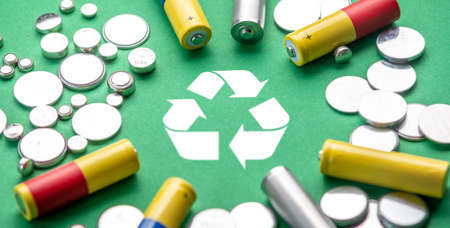 Used batteries and recycling symbol. Concept of ecological safety and eco friendly behavior.の写真素材