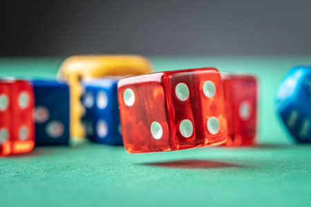 Colorful dices on the green table. The concept of a casino and a lucky chance to winの写真素材