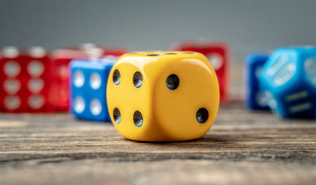 Colorful dices on the wooden table. The concept of a casino and a lucky chance to winの写真素材