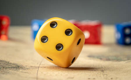 Colorful dices on the map. The concept of board games and a lucky chance to winの写真素材
