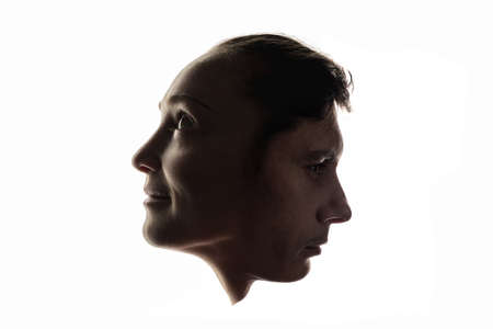 Photo montage of male and female faces on a white background. Concept of the unity of man and woman.の写真素材