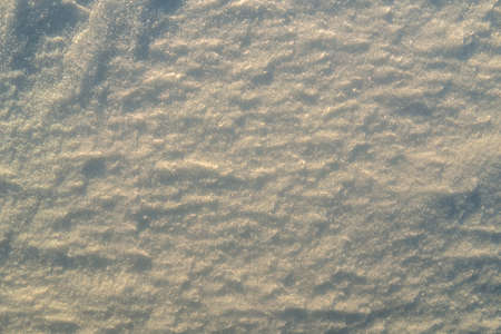 Uneven texture of snow in the sunset light.の写真素材