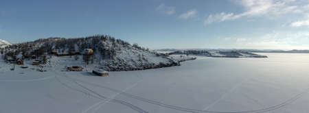 Beautiful landscape of winter snow-covered Lake Baikal and the surrounding mountains. bird's-eye view.の写真素材
