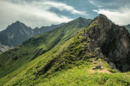 Summer landscape of a green mountain valley. The beauty of the Alpine, Caucasian mountains.の写真素材