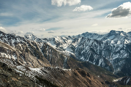 Landscape of snow-capped peaks of the rocky mountains in Sunny weather. The concept of nature and travelの写真素材