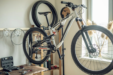 Mountain bike in the repair shop at the stand. Concept of preparation for the new season, repair and maintenanceの写真素材