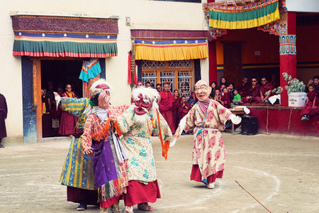LAMAYURU, INDIA - JUNE 22, 2017: Unidentified buddhist lamas dressed in mystical mask dancing Tsam...