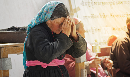India - June 18 2017: Old buddhist local women praying at Ladakh Jo Khang Temple in leh main bazaar, Leh Ladakh - Indiaのeditorial素材