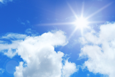 The sun shines bright in the daytime in summer. Blue sky and clouds.の写真素材