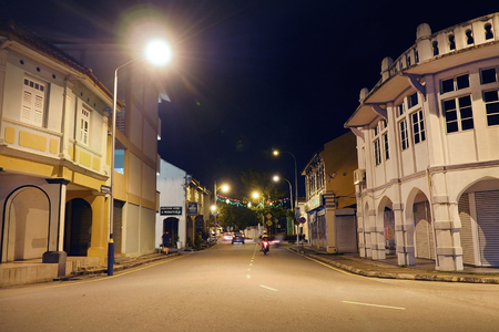 Malaysia - AUGUST 17 2017: Old local vintage building at night time with traffic ligh in Georgetown Penang, Malaysiaのeditorial素材