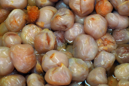 Traditional asian local dessert - pickle plum in a tray at local market in Penang Malaysiaの写真素材