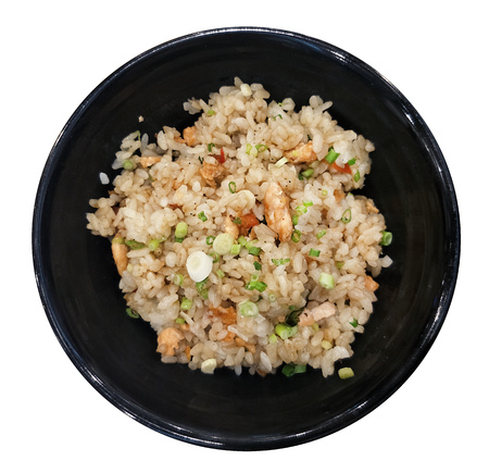traditional Japanese salmon fried rice served on black bowl view from top isolated on white background with clipping pathの写真素材