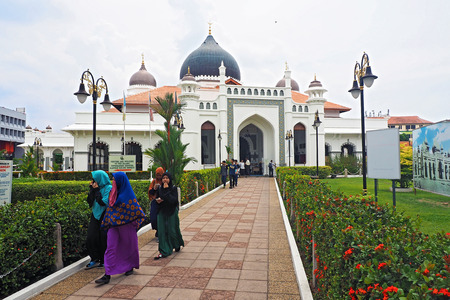 Malaysia - AUGUST 19 2017: Kapitan Keling Mosque with group of muslim people in Georgetown Penang Malaysiaのeditorial素材