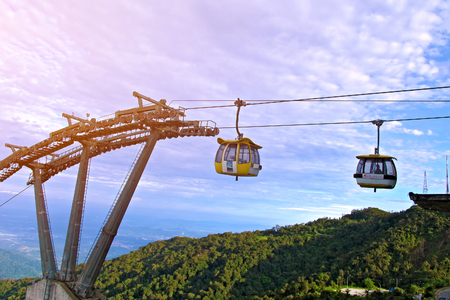 Malaysia - MAY 13 2013: the Cable Car with blue sky background and green forest mountain in Genting Highland in Malaysiaのeditorial素材