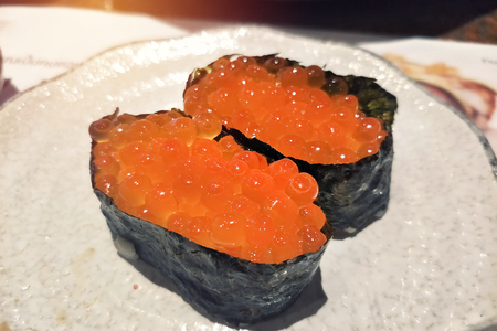 paired of a lot of salmon egg sushi wrapped with seaweedの写真素材