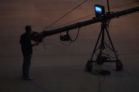 man control live stage camera in silhouette photographyの写真素材