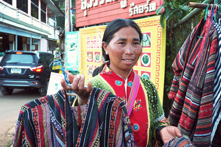 CHIANG MAI THAILAND - 30 January 2018: local woman from Mhong mountain tribe that locate close to Thailand and Myanmar border sell the hand made t-shirt at Doi Ang Khang, Chiang Mai, Thailandのeditorial素材