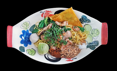 thai spicy dried noodle called Tom Yum Haeng served in common thai style bowl isolatedの写真素材