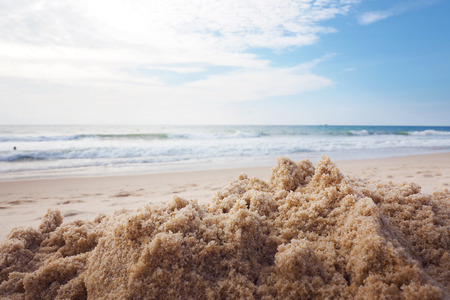beach sand dune with blue sea ocean with beautiful nice cloudy skyの写真素材