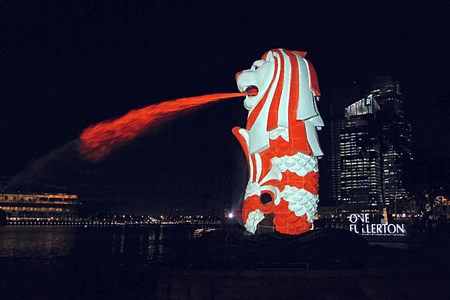 Singapore - 15 MAY 2011: lighting performance show Merlion statue in red and white color like a singapore flag themeのeditorial素材