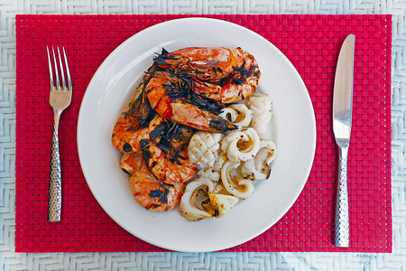 enjoy eating fresh grilled prawn and squid at luxury restaurantの写真素材