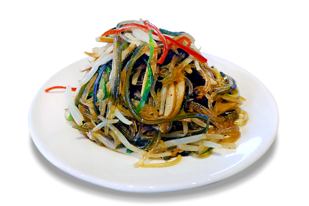 Chinese seaweed salad with sesame oil green onion beansprout and bell pepper isolated on white backgroundの写真素材