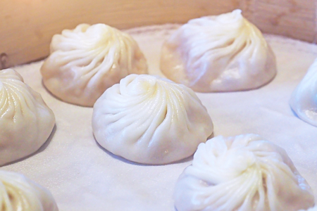 close up steamed Xiao Long Bao and served on bamboo basket - traditional chinese foodの写真素材