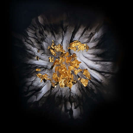 gold leaf on black marble backgroundの写真素材
