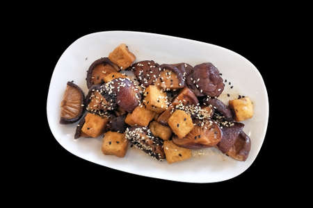 asian style food - shiitake mushroom and tofu stir-fried with soya sauce photo from above top view isolatedの写真素材