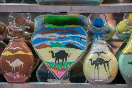 Sand bottles of colored sand camelsの写真素材