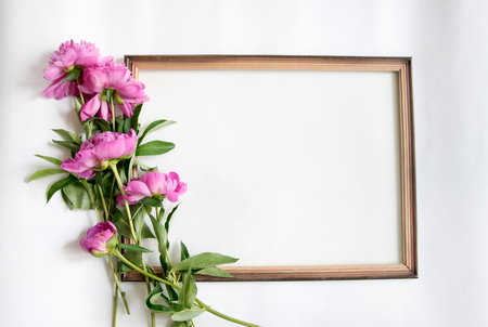 Mocup notebook with a clean sheet of pink peoniesの写真素材