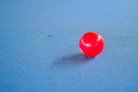Red snooker ball on the pool table.の写真素材