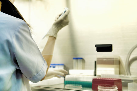 The woman researcher is using the Pipette size 200 - 1000uL for do the research of drugs or...
