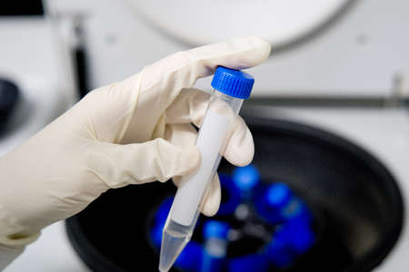 The researcher is using centrifuge tube 15 ml to do the lab test in the laboratory room.の写真素材