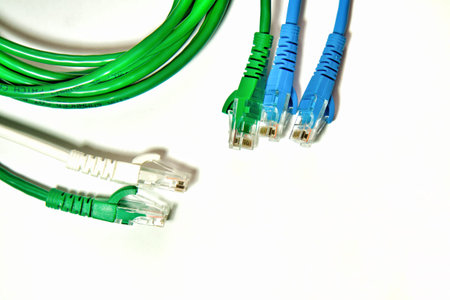 Blue and Green LAN cable on the white background.