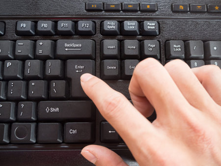 Man Press Enter on His Notebook
