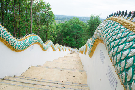 Temple Stairway Chom Chaeng Temple in the mist at evening , Nan, Thailandの写真素材