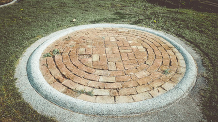 Old brick in circle concrete garden park.Floor stone street texture.Rock pattern flooring...